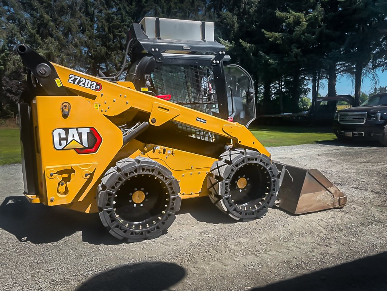 This image shows the EWRS HS Bobcat solid tires installed on a CAT 272D3 HS