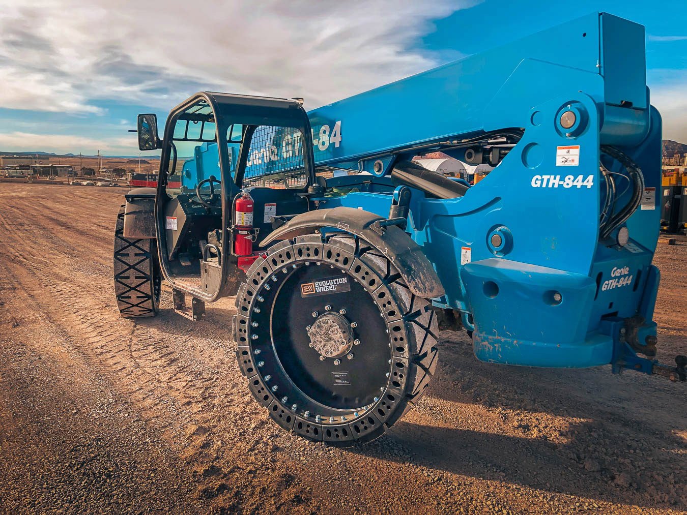 This image shows our telescopic forklift tires for a blue Genie telehandler.