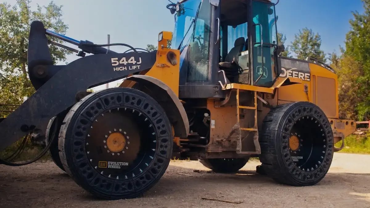 544J high lift loader on airless tires
