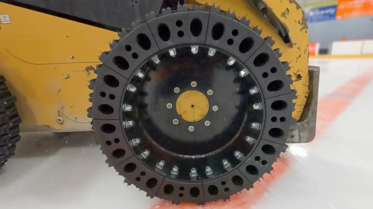 snow skid steer tire with studs