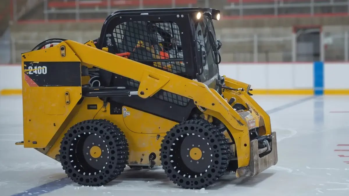 snow skid steer tire with studs