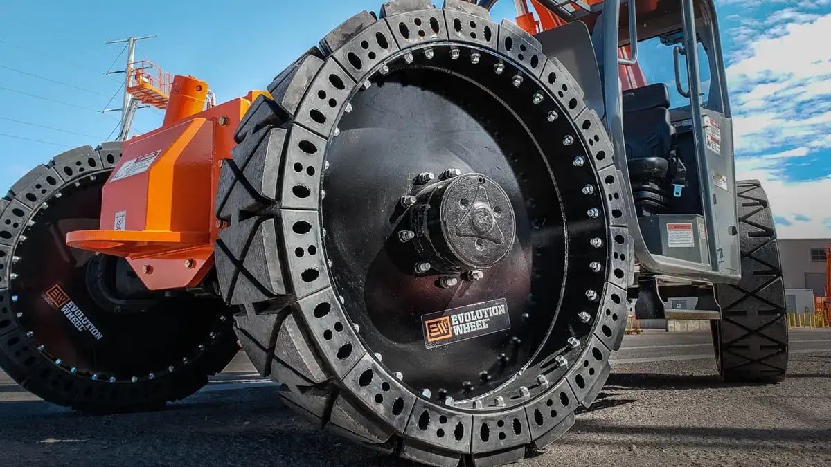 Side profile of solid rubber telehandler tires featuring specialized tread for hard surface longevity.